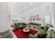 Bright and airy living room with high ceilings, large windows, and stylish decor at 9105 Chenin Ave, Las Vegas, NV 89129