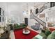 Spacious living room with high ceilings, contemporary decor, and direct access to the staircase at 9105 Chenin Ave, Las Vegas, NV 89129