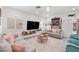 Comfortable living room with modern furniture, plush cushions, and a large flat-screen TV at 9105 Chenin Ave, Las Vegas, NV 89129