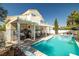 Backyard showcasing the pool, pergola, and outdoor cooking area for entertainment at 9105 Chenin Ave, Las Vegas, NV 89129