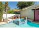 Outdoor oasis featuring a pool, spa, and playful decorative statues at 9105 Chenin Ave, Las Vegas, NV 89129