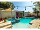 Relaxing pool area with decorative elements and a charming shed at 9105 Chenin Ave, Las Vegas, NV 89129