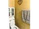 Cozy bathroom featuring a toilet, cabinet, and towel rack at 9148 Patrick Henry Ave, Las Vegas, NV 89149