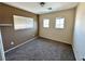 Bedroom with neutral tones and natural light from two windows at 9148 Patrick Henry Ave, Las Vegas, NV 89149