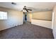 Upstairs bonus room with carpet, ceiling fan and multiple doorways at 9148 Patrick Henry Ave, Las Vegas, NV 89149