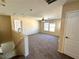 Open bonus room with carpet, ceiling fan, and natural light at 9148 Patrick Henry Ave, Las Vegas, NV 89149
