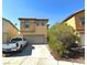 Inviting two-story home with a two-car garage and well-maintained front yard at 9148 Patrick Henry Ave, Las Vegas, NV 89149