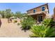 Backyard view showcasing desert landscaping, plants, and privacy, perfect for outdoor enjoyment at 9163 W Torino Ave, Las Vegas, NV 89148