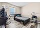 Cozy bedroom with a bed, desk, and chair, perfect for a student or home office at 9163 W Torino Ave, Las Vegas, NV 89148