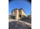 Charming two-story home features a two-car garage, arched walkway, and landscaped surroundings at 9163 W Torino Ave, Las Vegas, NV 89148
