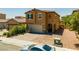 Beautiful two-story home with a well-manicured front yard and a paved driveway at 9163 W Torino Ave, Las Vegas, NV 89148