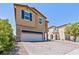 Exterior of a two-story home with a two-car garage and a paved driveway at 9163 W Torino Ave, Las Vegas, NV 89148