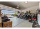 Spacious garage with ample storage for bikes, sports equipment, and a workbench area at 9163 W Torino Ave, Las Vegas, NV 89148