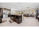 Beautiful open-concept kitchen with granite counters, stainless appliances, and an island with pendant lighting at 9163 W Torino Ave, Las Vegas, NV 89148