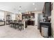 Well-equipped kitchen with granite countertops, seating at the island, and seamlessly connected to the dining area at 9163 W Torino Ave, Las Vegas, NV 89148