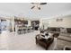 Spacious open-concept living area featuring tile flooring and views of the kitchen and backyard at 9163 W Torino Ave, Las Vegas, NV 89148