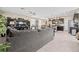 Open-concept living room, seamlessly connected to the kitchen and dining area, creating a spacious gathering spot at 9163 W Torino Ave, Las Vegas, NV 89148