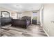 Spacious main bedroom with dark wood furniture, wood-style floors, and ample natural light at 9163 W Torino Ave, Las Vegas, NV 89148