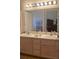 Bathroom featuring a double sink vanity with drawers and an oversized mirror at 9225 Lady Palm Ct, Las Vegas, NV 89147