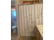 Bathroom featuring a white toilet, shower with decorative curtain, and vanity at 9225 Lady Palm Ct, Las Vegas, NV 89147