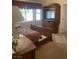 Spacious bedroom featuring a large bed, an entertainment center, and ample natural light at 9225 Lady Palm Ct, Las Vegas, NV 89147