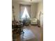 Bedroom featuring a desk, chair, shelving and a comfy armchair at 9225 Lady Palm Ct, Las Vegas, NV 89147