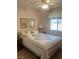 Bright bedroom with ceiling fan, patterned bedspread, and natural light from the window at 9225 Lady Palm Ct, Las Vegas, NV 89147