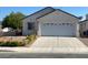 Charming single-story home with a two car garage and well-maintained landscaping in a suburban neighborhood at 9225 Lady Palm Ct, Las Vegas, NV 89147