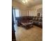 A stylish living room with a large sectional couch and neutral-toned decor at 9225 Lady Palm Ct, Las Vegas, NV 89147