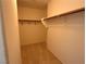 Walk-in closet with clothing racks and carpeted floor at 925 Scarlet Haze Ave, Las Vegas, NV 89183