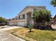 Two-story home with a well-maintained lawn and a two car garage at 925 Scarlet Haze Ave, Las Vegas, NV 89183