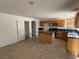 Functional kitchen featuring tile floors, wooden cabinets, and center island at 925 Scarlet Haze Ave, Las Vegas, NV 89183
