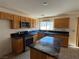 Spacious kitchen features stainless steel appliances, tile floors and island at 925 Scarlet Haze Ave, Las Vegas, NV 89183