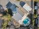 An aerial view of a single-Gathering home featuring a refreshing pool and a detached garage at 9435 Westwind Rd, Las Vegas, NV 89139