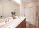 Well-lit bathroom with a double sink vanity and a shower-tub combination, offering modern convenience and functionality at 9451 Lunar Ray St, Las Vegas, NV 89143