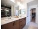 Stylish bathroom features a double vanity, modern fixtures, and walk-in closet at 9451 Lunar Ray St, Las Vegas, NV 89143