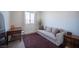 This bedroom has a pull out couch, desk, mirror, and natural light at 9451 Lunar Ray St, Las Vegas, NV 89143