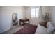 This bedroom has a sofa, desk, and large mirror, complete with a calming aesthetic at 9451 Lunar Ray St, Las Vegas, NV 89143