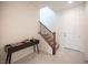 Bright entryway features stylish console table, modern decor and a staircase at 9451 Lunar Ray St, Las Vegas, NV 89143