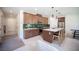 Stylish kitchen features a central island with seating and stainless steel appliances at 9451 Lunar Ray St, Las Vegas, NV 89143