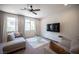 Bright living room features large windows, a ceiling fan, and comfortable seating at 9451 Lunar Ray St, Las Vegas, NV 89143