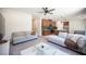 Open-concept living room with modern furniture, adjacent to the kitchen and dining area at 9451 Lunar Ray St, Las Vegas, NV 89143