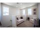 This loft features neutral walls, carpet floors, and a comfortable seating arrangement at 9451 Lunar Ray St, Las Vegas, NV 89143