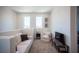 This loft features carpet floors, neutral walls, and cozy furniture with natural light at 9451 Lunar Ray St, Las Vegas, NV 89143