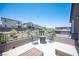 A cozy outdoor patio with comfortable seating and neighborhood views, perfect for relaxing and entertaining guests at 9451 Lunar Ray St, Las Vegas, NV 89143