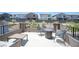 Outdoor patio with firepit table, chairs, and community views at 9451 Lunar Ray St, Las Vegas, NV 89143