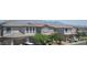 Charming street view of modern homes with desert landscaping and mountain views at 9451 Lunar Ray St, Las Vegas, NV 89143