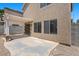 Backyard featuring concrete patio, pergola, slider to house, privacy fence, and gravel ground at 9625 Gatesville Ave, Las Vegas, NV 89148