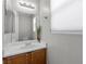Bathroom featuring a vanity with a modern sink, updated fixtures, and a window providing natural light at 9625 Gatesville Ave, Las Vegas, NV 89148
