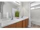 Bathroom with double sinks and a walk-in shower at 9625 Gatesville Ave, Las Vegas, NV 89148